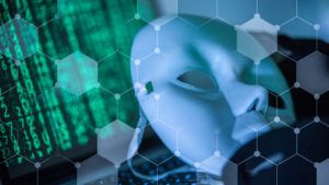 Hacker wear an anonymous mask.