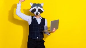 Photo of astonished guy win investment tender competition wear raccoon mask vest isolated yellow color background