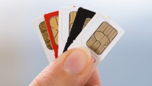 hand holding sim cards