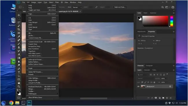 Inexplicably, LastOS includes the macOS Mojave wallpaper, as here opened in PhotoShop. Photoshop on WINE on Last OS, showing the macOS Mojave wallpaper and the Edit menu