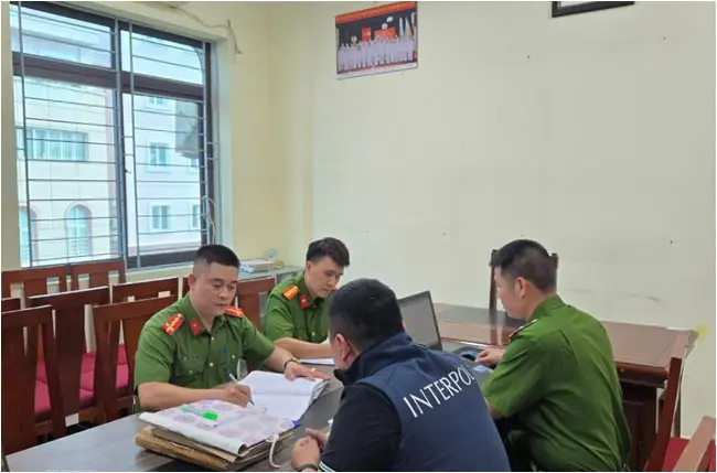 Interpol and domestic police officers examine documents related to Operation Secure's investigations into infostealer malware in Asia - courtesy of Interpol Interpol and domestic police officers examine documents related to Operation Secure's investigations into infostealer malware in Asia