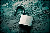 Unlocked padlock laying on a circuit board
