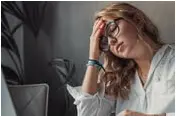 Frustrated woman using PC