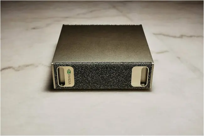 The DGX Spark's golden design is clearly inspired by the original DGX-1 system hand delivered by Jensen Huang to Elon Musk at OpenAI in 2016 The DGX Spark's golden design is clearly inspired by the original DGX-1 system hand delivered by Jensen Huang to Elon Musk at OpenAI in 2016